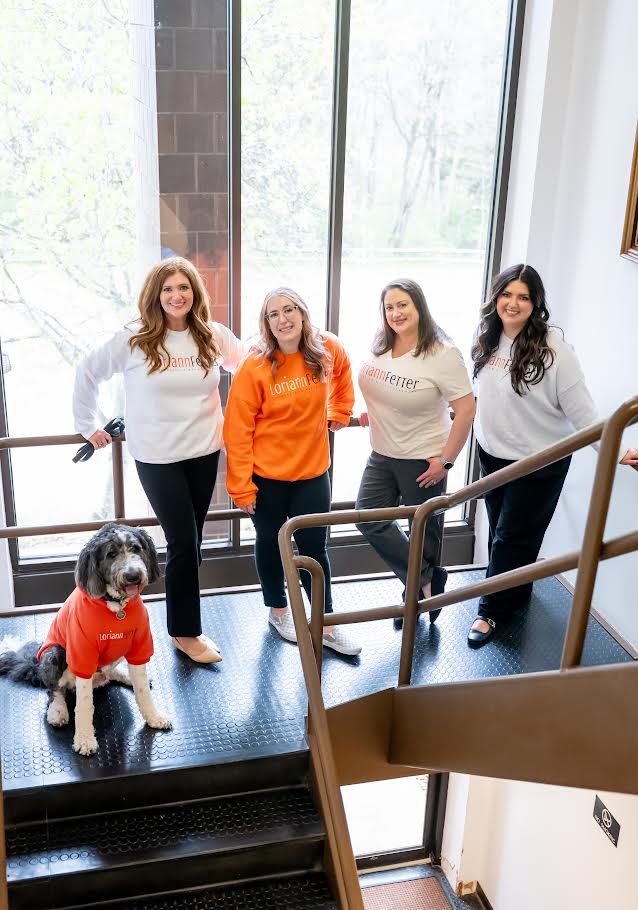 Loriann Fetter team in branded sweatshirts